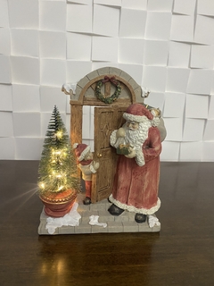 papai noel na porta com luz na internet