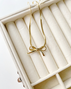 Conjunto dorado moño