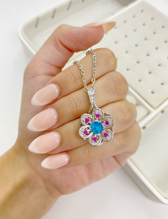 Conjunto dije giratorio flor