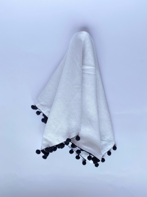 Servilleta blanca pompòn negro