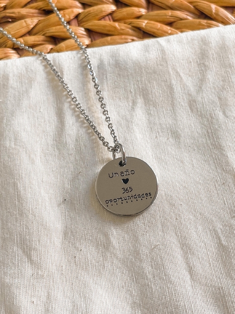 Dije frase positiva acero con cadena