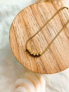 Pulsera acero dorado 5 bolitas