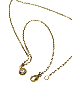 CADENA ACERO DORADO CON DIJE TIPO SUSANITO en internet