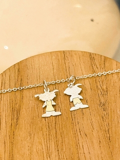 DIJE LOQUITOS PLATA Y ORO CHAPITA CON CADENA DE ACERO BLANCO