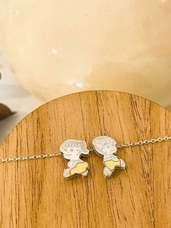 DIJE PLATA Y ORO NENE/NENA (FRENTE Y DORSO) CON CADENA ACERO BLANCO - Ivanala Joyas