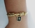Bracelete Deus Fé Paz Berloque Bíblia - Banhado a Ouro 18k na internet