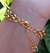 Pulseira Nossa Senhora Aparecida Resina Preta - Banhada a Ouro 18k na internet