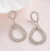 BRINCO GOTA TRABALHADO EM STRASS COM FUNDO BRANCO - código 23