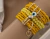 MIX PULSEIRA MIÇANGAS AMARELAS, COM PINGENTE OLHO GREGO E CORAÇÕES