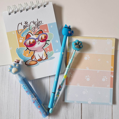 Conjunto escolar Kit Cat's Style com um caderno fofo, caneta e lapiseira azul, marca texto e folhas adoráveis.