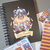 Conjunto de itens da Coleção Kitty Pawtter com planner, calendário 2025, caderno, bloquinho e marcadores de página. Ilustrações inspiradas nos personagens de Harry Potter.