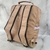 MOCHILA IMPERMEABLE CON FRANJA DE CUERO JOUP en internet