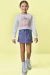 Conjunto de Blusa Boxy em Meia Malha e Short Saia em Malha Denin 90679 Kukiê Infantil Menina
