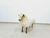 Banco inspirado em François Xavier Lalanne com patas e rosto latão polido