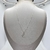 Colar feminino de prata 925 com pingente em forma de borboleta.