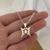 Collar de acero blanco con dije de Mariposa Calada