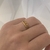 Anillo doble con rombos de acero dorado