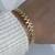 Esclava DOTS Acero dorado