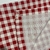 Trilho de mesa xadrez vermelho 46x135cm (semi impermeável) na internet