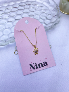 Colar menininho cravejado na internet