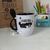 Caneca com colher preta Logística - comprar online