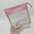 Necessaire transparente com detalhes em rosa, personalizada com o nome 