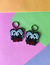 Brinco Amantes Addams