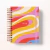 Planner Energia Colorida 2026 com capa espiralada e design abstrato em cores vibrantes