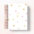 Agenda Confete com capa branca decorada com bolinhas coloridas e o ano 2026 em destaque.