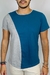 Camiseta trapézio agênero em destaque. Corte assimétrico divide a peça em duas cores, proporcionando um visual moderno e único.
