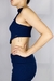 Top feminino em malha canelada, com design inovador e detalhes únicos. Confortável e versátil, ideal para compor looks modernos e cheios de estilo.
