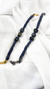 Pulseira regulável com trança de malha e berloques dos signos em opções dourado e grafite.