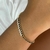 pulseira composiçao cravejada de zirconias preta e branca banhado a ouro com garantia - comprar online