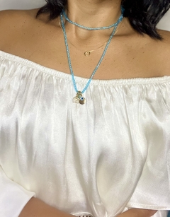 Pulseira da sorte azul detalhes banhado ouro 18kg na internet