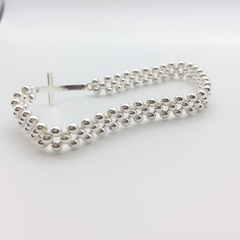 Pulsera Tejida Cruz en internet