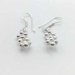 Arete tejido oval