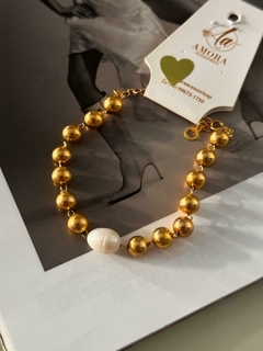 Pulseira esferas e pérola folheado na internet