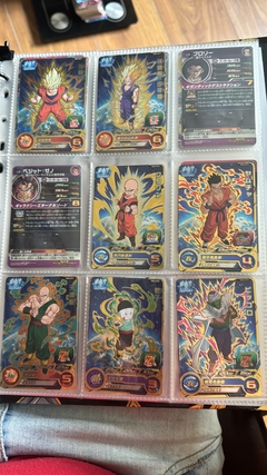 Imagen de 671 cartas de dragon ball héroes + 26 packs sellados Vjump + 100 slaves + binder con 25 micas