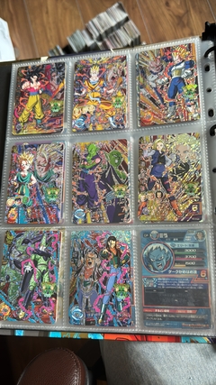 671 cartas de dragon ball héroes + 26 packs sellados Vjump + 100 slaves + binder con 25 micas - Gamebusters