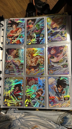 Imagen de 671 cartas de dragon ball héroes + 26 packs sellados Vjump + 100 slaves + binder con 25 micas