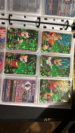 671 cartas de dragon ball héroes + 26 packs sellados Vjump + 100 slaves + binder con 25 micas - Gamebusters