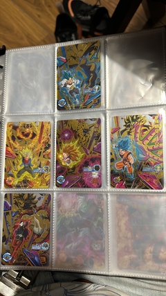 Imagen de 671 cartas de dragon ball héroes + 26 packs sellados Vjump + 100 slaves + binder con 25 micas