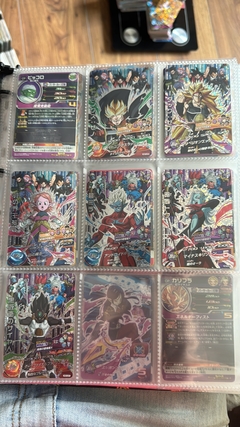 671 cartas de dragon ball héroes + 26 packs sellados Vjump + 100 slaves + binder con 25 micas - Gamebusters