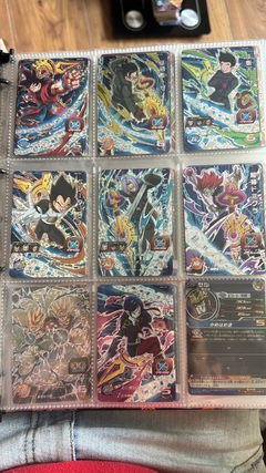 671 cartas de dragon ball héroes + 26 packs sellados Vjump + 100 slaves + binder con 25 micas