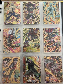 671 cartas de dragon ball héroes + 26 packs sellados Vjump + 100 slaves + binder con 25 micas