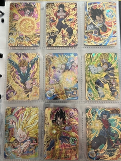 671 cartas de dragon ball héroes + 26 packs sellados Vjump + 100 slaves + binder con 25 micas - Gamebusters