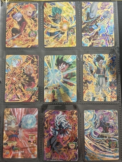 671 cartas de dragon ball héroes + 26 packs sellados Vjump + 100 slaves + binder con 25 micas