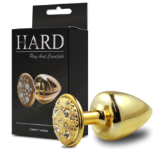 PLUG METÁLICO COM PEDRAS CRAVEJADAS EM STRASS HARD M DOURADO