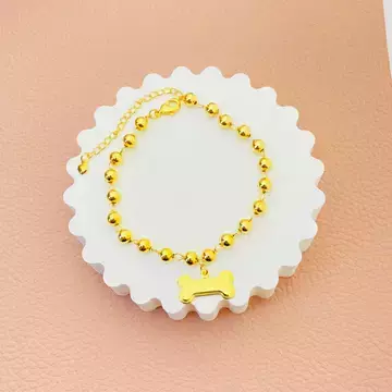 Pulseira de bolinhas e ossinho banhada a ouro