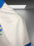 CAMISA DO BRASIL BRANCA/AZUL COM GOLA - MASCULINA na internet